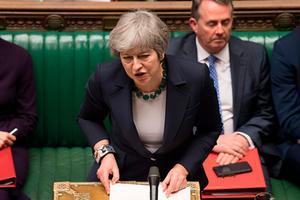 Premier May, woensdagavond in het Britse parlement. beeld AFP, Mark Duffy