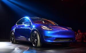 De Model Y is een zogenoemde cross-over, waarin kenmerken van normale passagiersauto’s worden gecombineerd met die van een SUV. beeld AFP