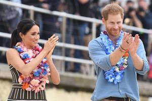 De Britse prins Harry en zijn vrouw Meghan in Sydney. beeld EPA