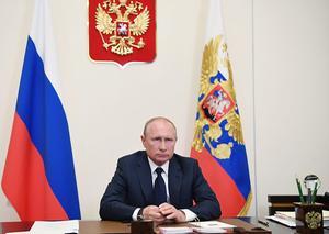 De Russische president Vladimir Poetin zei maandag in een toespraak dat de Russen deze week weer aan het werk moeten. beeld EPA