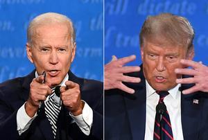 De Amerikaanse president Donald Trump (R) en zijn Democratische uitdager Joe Biden tijdens het eerste verkiezingsdebat. beeld AFP, Jim Watson